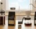 Side-by-side comparison of a glass French Press carafe and a pour-over dripper next to a bag of fresh Adiramo Coffee beans.