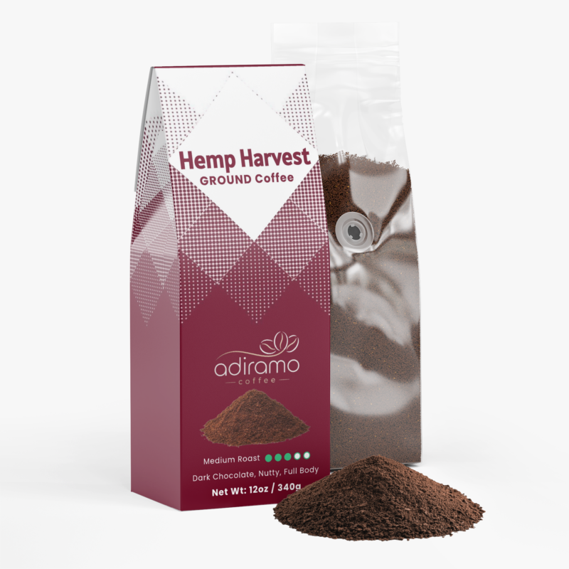 Adiramo Hemp Harvest 12oz maroon pattern ground coffee box package with dark chocolate and nutty descriptors standing beside a clear valve bag and pile of fresh ground coffee