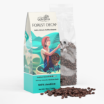 Adiramo Forest Decaf 12oz medium roast coffee package with colorful coffee farm illustrations standing beside a clear valve bag of whole coffee beans