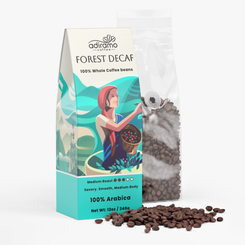 Adiramo Forest Decaf 12oz medium roast coffee package with colorful coffee farm illustrations standing beside a clear valve bag of whole coffee beans