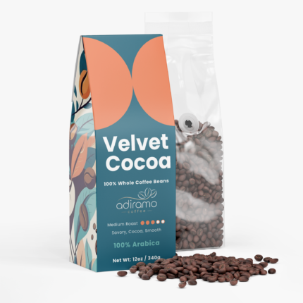 Adiramo Velvet Cocoa 12oz teal and orange retail coffee box standing beside a clear valve bag of whole coffee beans